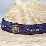 Woven hat with beaded and woven band.
