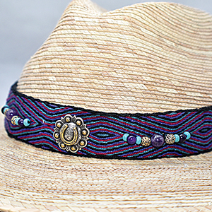 Woven hat with beaded and woven band.